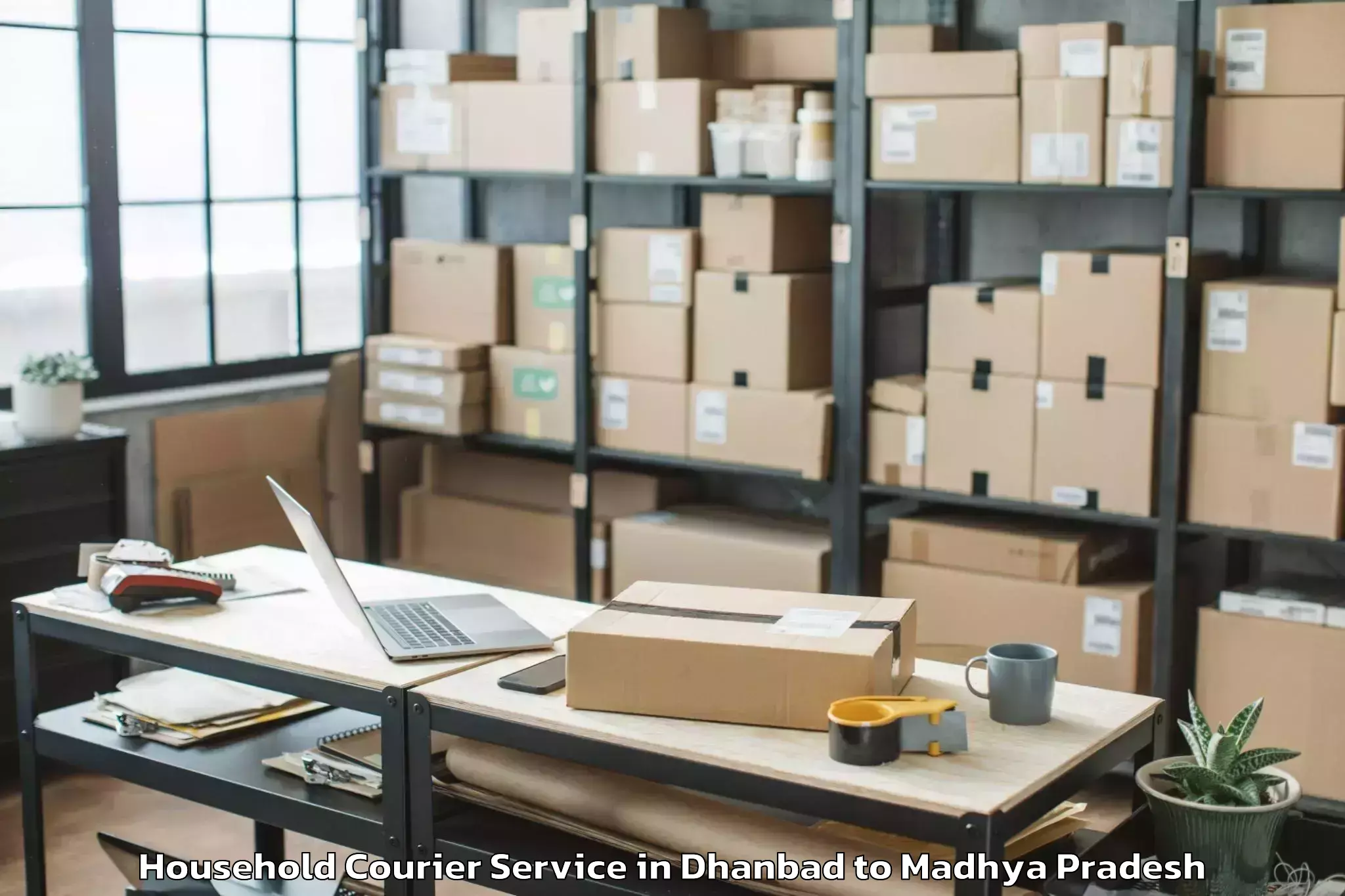 Book Dhanbad to Madhyanchal Professional Unive Household Courier Online